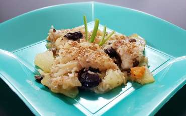 Codfish with potatoes, olives and sesame seeds