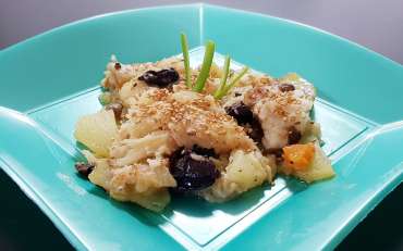 Codfish with potatoes, olives and sesame seeds