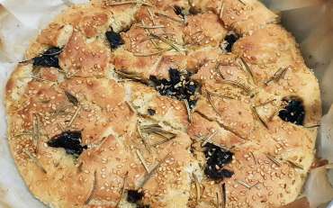 White pizza with rosemary, black olives and sesame of Ispica